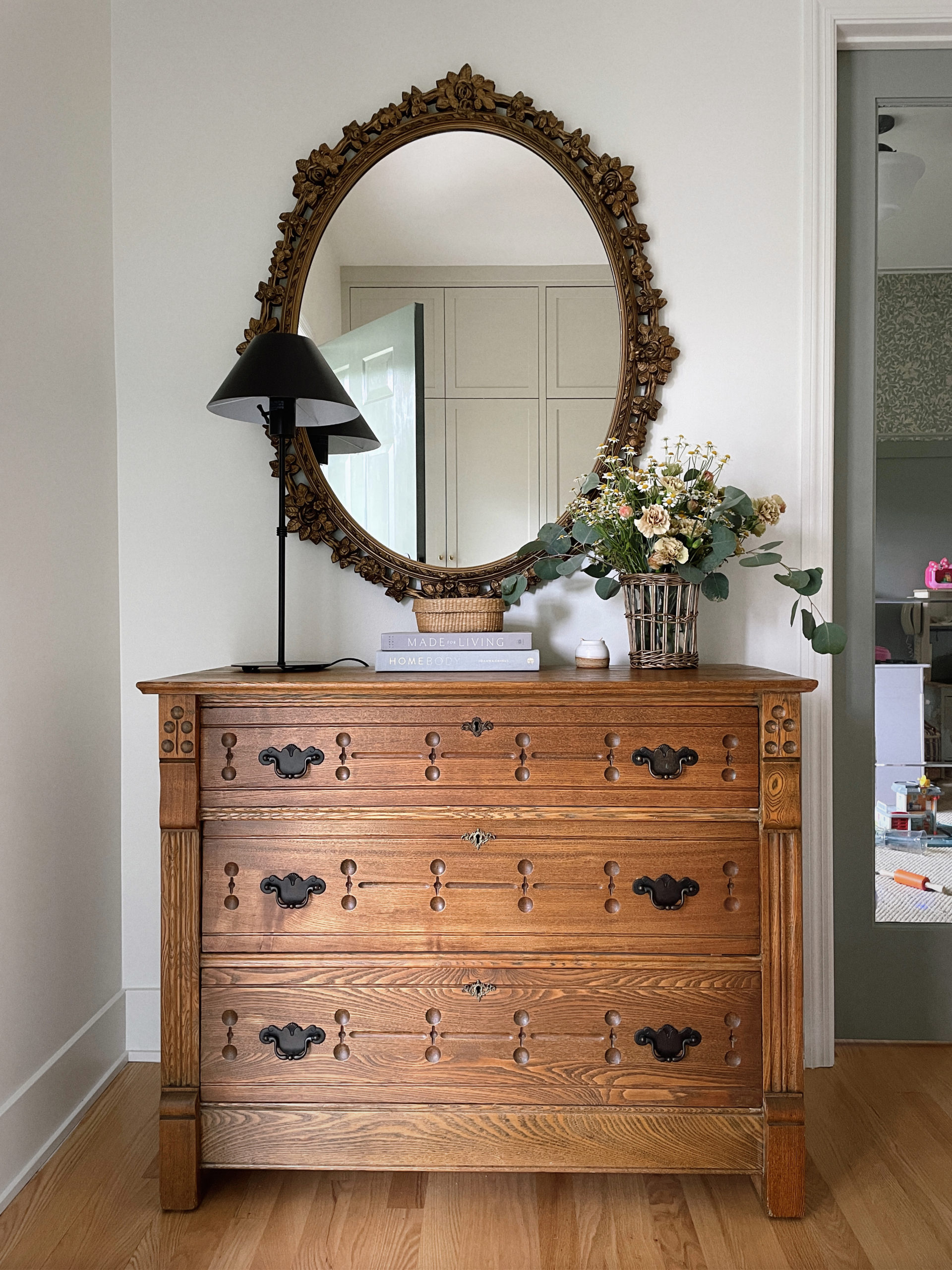 vintage dresser and gold mirror decor